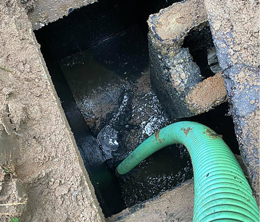 Septic pumping truck cleaning residential septic tank