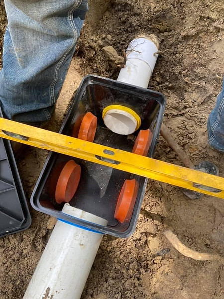 R&E Septic Brothers team working on a septic system in Crisfield